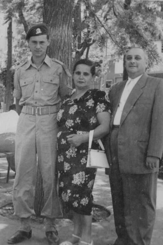 Philip (left), when he served in the Israel Defense Forces, standing with his mother, Iska, and stepfather, Kopel. Israel, circa 1950s.