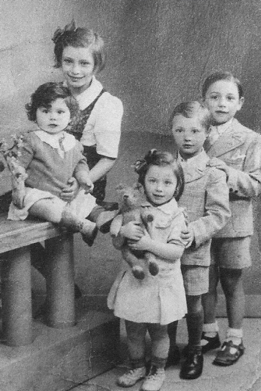 The Fikman children in Paris, circa 1940. On the left: Isabelle and Mireille (in front). On the right (back to front): Fernand, Maurice and Denise.