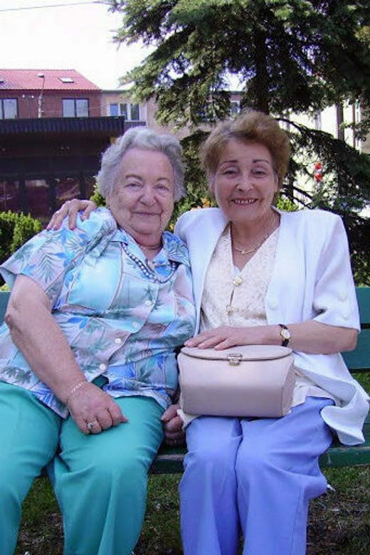 Mary (left) visiting with Helana Jaczek, the daughter of Krystyne Panek, who was instrumental in helping Mary and her family survive the war. Grójec, Poland, 2006.