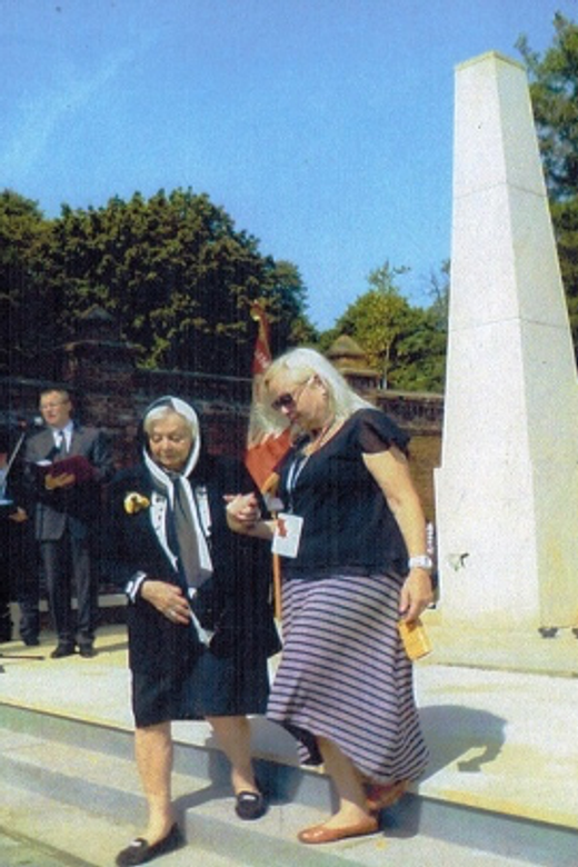 Freda (left) at the Lodz memorial to the victims of the Holocaust, located in a Jewish cemetery. Lodz, Poland, 2014.