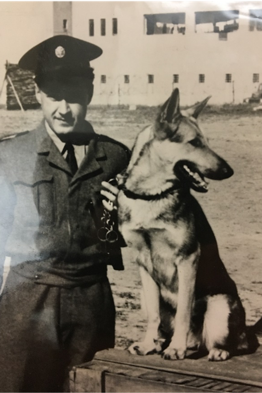 Israel with his tracking dog, while working for the police force. Israel, 1959.