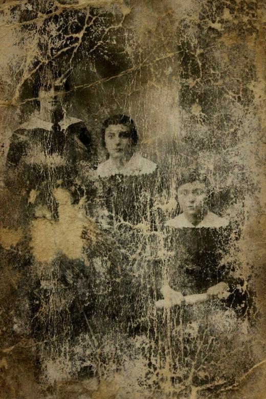 The only picture of Andrew's mother, Mira (centre). Andrew's father hid it in the sewer when he escaped the ghetto. Date and place unknown. Courtesy of Crestwood Oral History Project.